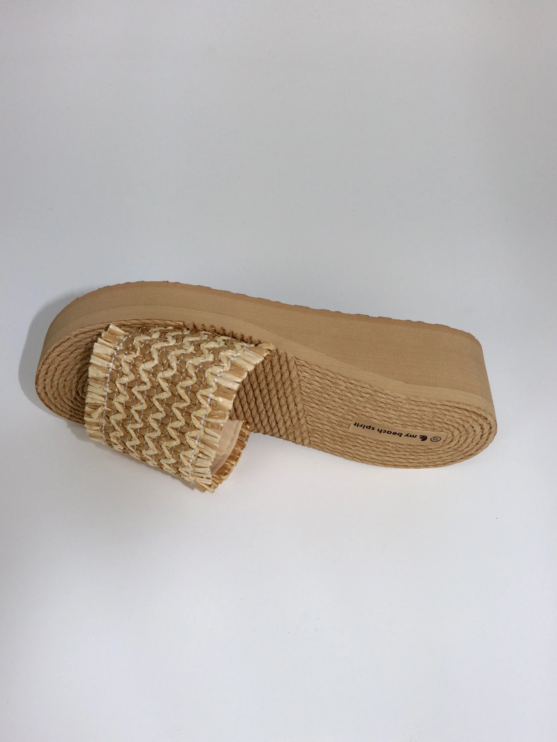 Heel compensed beach slipper